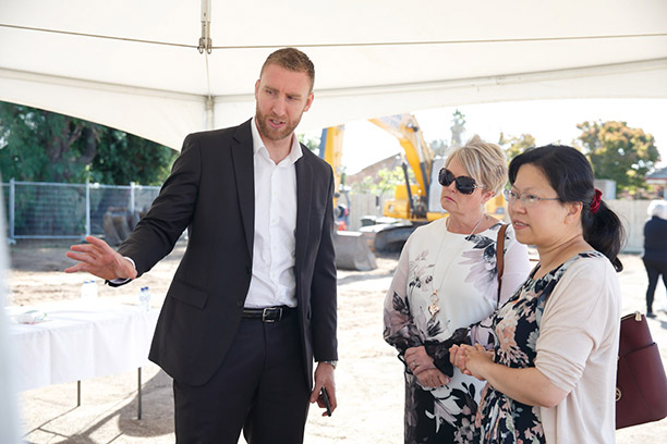 Unison CEO James King showing the plans for the new development to Cr McIntyre and Cr Hill