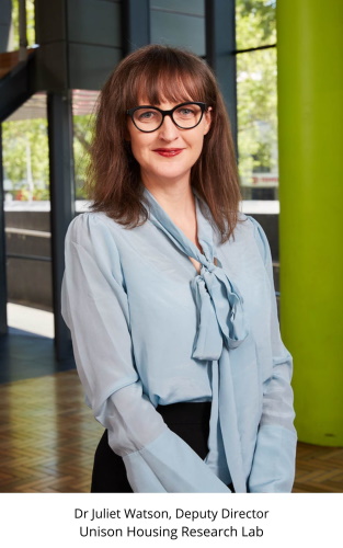 A woman with shoulder-length brown hair and glasses, wearing a light blue blouse, stands indoors with a large green pillar and windows in the background. Text below reads: Dr Juliet Watson, Deputy Director, Unison Housing Research Lab.